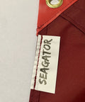 Close-up of Dive Flag With Removable Stiffening Pole 20x24 Inches, showing eyelet and edge detail with 'SEAGATOR' label.