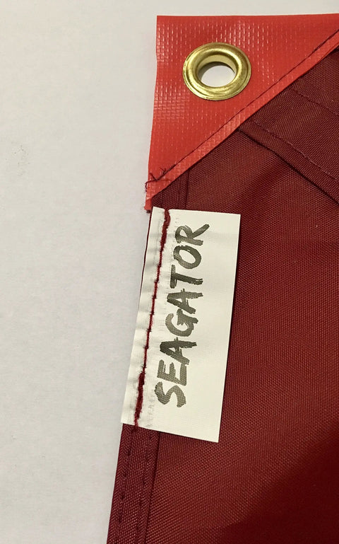 Close-up of Dive Flag With Removable Stiffening Pole 20x24 Inches, showing eyelet and edge detail with 'SEAGATOR' label.