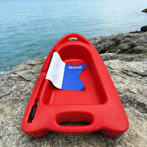 Spearfishing Float Boat With Carry Straps Foldable Flagpole And Compact Storage Red Buoy On Rocks Near Sea