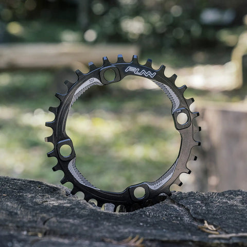 Single Speed Ready Narrow Wide 34T Chainring For 9 To 12 Speed Chains 104mm BCD Crankset on outdoor wood surface