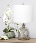 Textured Glass Table Lamp With Clear Blue Dome Base And White Fabric Drum Shade, Easy Rotary Socket Switch, placed on table