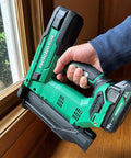 18V MultiVolt Cordless Brushless Impact Driver And 18 Gauge Brad Nailer Combo Kit in use on a window frame