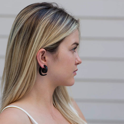 Woman wearing Spiral Fake Gauge Earrings Set in Black with Organic Wood and 316L Surgical Steel, side profile