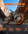 Heavy Duty 5600W Dual Motor Electric Bike For Adults on winding road with rocky terrain, showcasing 26x4 fat tires.