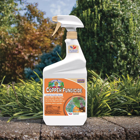 Captain Jacks Copper Fungicide Ready To Use Spray For Organic Gardening 32 Oz Controls Fungal Diseases bottle in garden