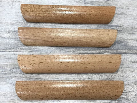 Four beech wood drawer pulls with smooth painted finish, showing the front view of Six Pieces 4.84 Inch Wood Furniture Pull Handles.