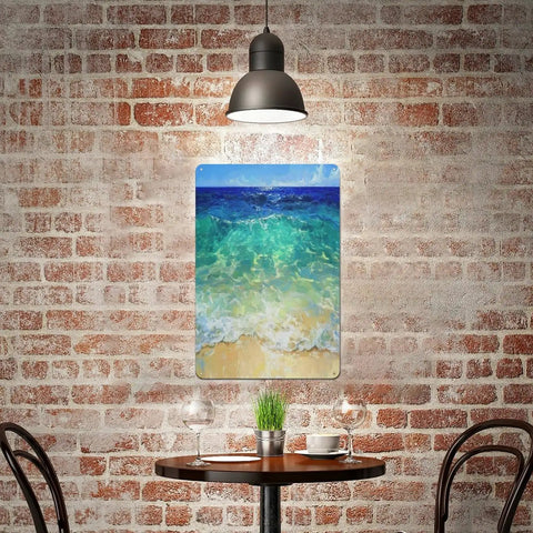 Cozy cafe interior with brick wall featuring a vibrant ocean waves tin sign poster under pendant light.