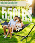 Free Standing Hammock With Stand Built For Tough Use 550 Lb Capacity Anti Flip Curved Spreader Bars Premium Cotton in use outdoors