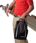 Golf Shoe Bag With Zippered Carrier And Ventilation External Pocket for Socks Tees and Accessories held by golfer in red shirt.