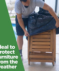 Person covering outdoor furniture with 95 Gallon Extra Large Trash Bags 61x68 Inches 1.2 Mil Thick Beefy Heavy Duty Contractor Bags
