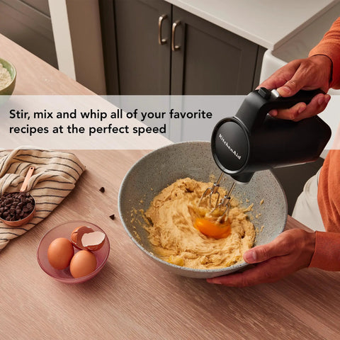 Cordless Hand Mixer With Included Battery Pack Brings You Up To Sixty Minutes Run Time For Easy Mixing And Whipping Zero Cable Hassle in action mixing batter.