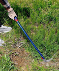 Person using Detachable Grass Sickle Folding Harvest Scythe Tool With Carbon Steel Blade And Anti Slip Rubber Handle on grass