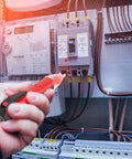 Non Contact AC Voltage Detector Pen for quick cable and socket voltage checks in use near an electrical panel