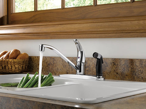 Single Handle Kitchen Sink Faucet With Integrated Side Sprayer Chrome Finish 360 Degree Swivel No Fuss Easy Install 3 Hole 8 Inch Design Durable Chrome Tap Lifetime Limited Warranty installed on a kitchen countertop with running water and vegetables in the sink.