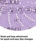 Close-up of Xtract Cubitron II Hookit Clean Sanding Film Disc 775L 6 Inch with dust extraction and hook and loop attachment details