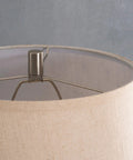 Close-up of Captain Table Lamp With Clear Textured Glass And Rope Wrap Finish, focus on metal frame and fabric shade