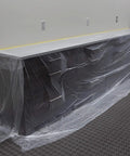 Pre Taped Masking Film With Three Quarters Inch Tape For Auto Body Protection covering a cabinet, showing film and tape application
