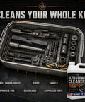 Pro Grade Ultrasonic Gun Cleaner Solution That Hits Different On Stubborn Carbon And Gun Oil With Zero Hard Scrubbing One Concentrated Gallon Mixes Straight Into Two Hundred Ready To Shoot Parts USA Made in stainless cleaning tank with gun components.