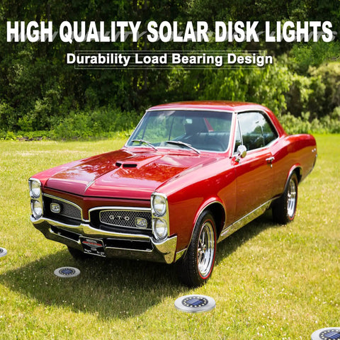 Classic red car parked on grass with Waterproof Outdoor Solar Ground Lights Disk LEDs 16 Lamp Array in garden setting