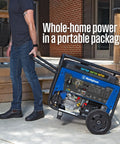 Man transporting Tri-Fuel Portable Generator with Remote Electric Start, Transfer Switch Ready, 12500 Peak Watts outdoors