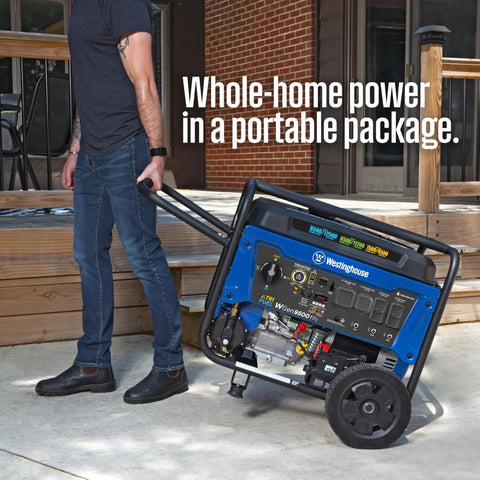 Man transporting Tri-Fuel Portable Generator with Remote Electric Start, Transfer Switch Ready, 12500 Peak Watts outdoors