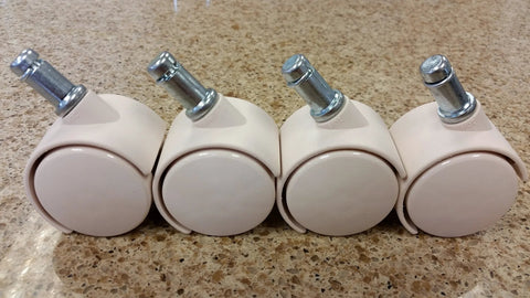 Front view of set of four almond Chromcraft furniture casters with metal stems