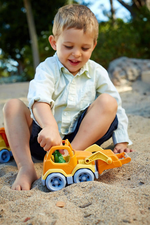 Child playing with Eco Friendly Scooper Construction Truck Toy Made From Recycled Plastic, Kid Safe For Indoor And Outdoor Play