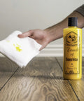 Beeswax Wood Polish And Restorer Bundle For Hardwood Floors, All In One Cleaner And Conditioner Spray With Real Orange Oil bottle on floor