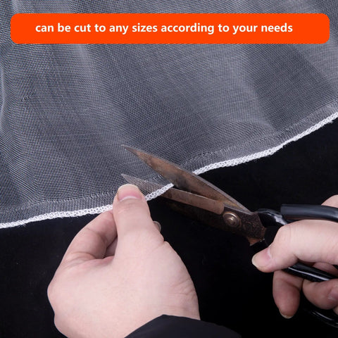 Close-up of scissors cutting Insect And Bird Barrier Garden Netting 20 X 10 Feet Easy Cut Plant Cover, showing flexible mesh.