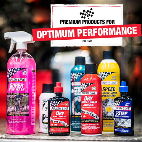 Display of Finish Line bike care products including lubricants and cleaners, emphasizing premium performance, in a shop setting.