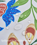 Close-up of spillproof and wrinkle-resistant 60 Inch Round Outdoor Tablecloth With Umbrella Hole And Zipper in paisley design