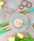 Decorating a cookie with a brush on a non-slip silicone mat in a 123 Piece Cookie Decorating Kit With Large Acrylic Turntables.