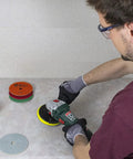 Man using 5 Inch Diamond Polishing Pads Wet Dry Set For Quartz Marble Granite Concrete Countertops Includes Grit 50 100 200 400 800