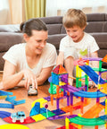 Parent and child playing with 12 Piece Magnetic Support Column Expansion Pack For Race Track And Marble Run Builders