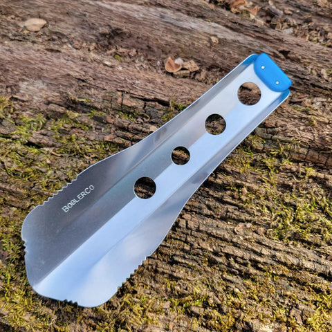 Ultralight Backpacking Trowel 0.48 Oz 13.5 G Blue With Lifetime Warranty Made In USA on mossy log