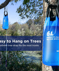 6L Gravity Water Filter System For Camping And Group Trips For The Crew NSF Tested and Certified hanging on a tree