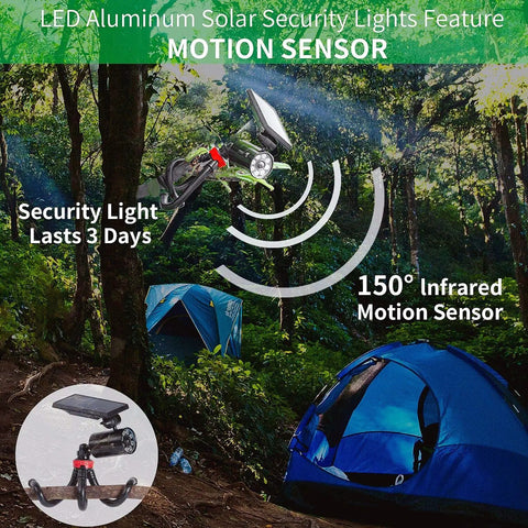 Motion Sensor Camping Lights With Sturdy Aluminum Case Outdoor Waterproof Security Spotlight in a forest campsite with tents.