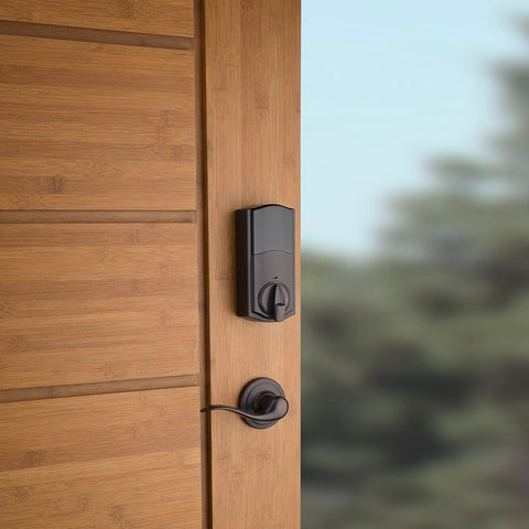 SmartCode 915 Touchscreen Electronic Deadbolt With Smart Key UL Listed Illuminated Keypad Auto Lock After 30 Seconds Easy Install In Minutes Venetian Bronze on wooden door