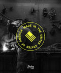 Made in USA label over a workshop scene with welding activity in progress, promoting American craftsmanship.