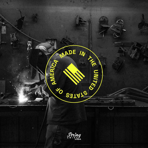 Made in USA label over a workshop scene with welding activity in progress, promoting American craftsmanship.