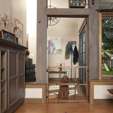 Living room with Position And Lock Tall And Wide Adjustable Baby Gate For Doorways 31 To 50 Inches Wide And 32 Inches Tall Easy One Hand Latch Kid Friendly Farmhouse Collection Safe Gate For Nurseries Stairs And Play Areas installed, dog visible behind gate.