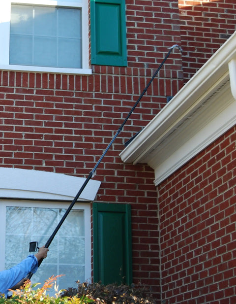 User utilizing Slick Heavy Duty Telescopic Video Inspection Camera With Built In Dvr Recording And Bright Five Inch Lcd Screen to inspect roof.