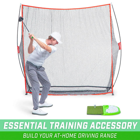 Person practicing golf swing indoors with Golf Hitting Mat With Real Turf Feel For Indoor And Outdoor Practice, net setup.