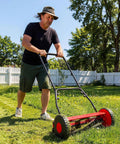 14 Inch Hand Push Reel Lawn Mower For Small To Medium Yards No Fuss Manual Cut With Precise Scissor Like Blades And Adjustable Height Settings For A Clean Healthy Lawn, man mowing grass