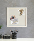 Rustic Linen Bulletin Board 14 By 14 Inch With White Wood Frame on gray wall with pinned photos