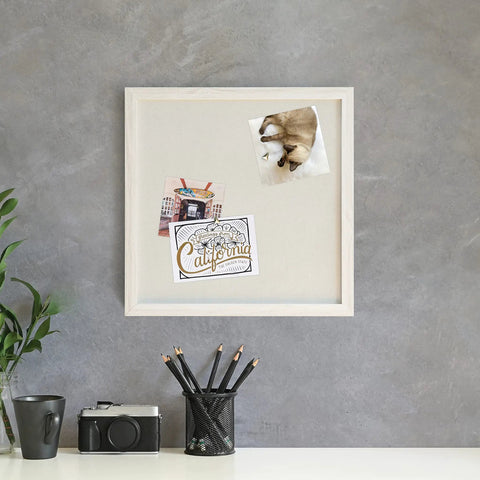 Rustic Linen Bulletin Board 14 By 14 Inch With White Wood Frame on gray wall with pinned photos