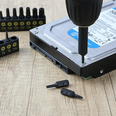 Heavy Duty 15 Piece Torx Bit Set T4 Through T40 Tamper Proof Security Star Bits 1/4 Inch Hex Shank used on a hard drive.