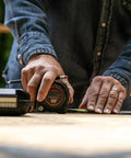 Person using 1-3/16 Inch By 25 Foot Dual Sided Tape Measure With Nite Eye Glow on a job site