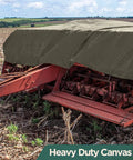 Waterproof Waxed Canvas Tarp Cover 21oz Heavy Duty Duck Cloth With Rustproof Brass Grommets For Camping Construction Gear And Outdoor Use 6 By 8 Foot Olive Drab covering farm equipment in field