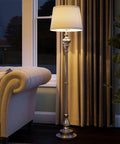 Tall Brushed Steel Floor Lamp With Classic Style, 59 Inch Height, 15 Inch Drum Shade, in a cozy living room setting